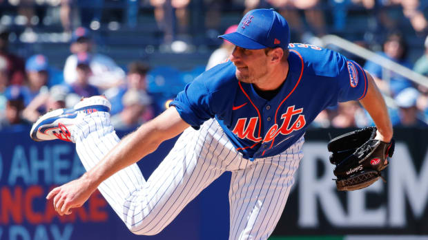 Mets pitcher Max Scherzer throws a pitch during a spring training game vs. the Nationals.